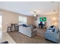 Bright and airy living room featuring sleek hard-surface flooring and neutral paint at 1929 Cove Point Rd, Port Orange, FL 32128