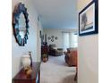 Inviting hallway offers a glimpse into the carpeted living room at 2101 N Atlantic Ave # 10, Daytona Beach, FL 32118