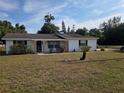 Charming single-story home with landscaped front yard and a welcoming porch at 2204 Poinsettia Dr, Deland, FL 32724