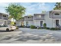 A row of gray townhouses with well-maintained landscaping in a peaceful neighborhood setting at 2329 River Ridge Rd # 4, Deland, FL 32720