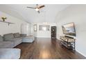 Hardwood floors and vaulted ceilings accentuate this open-concept living room, perfect for entertaining at 2448 Newmark Dr, Deltona, FL 32738
