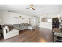 Spacious living room featuring hardwood floors, vaulted ceilings, and a neutral color palette at 2448 Newmark Dr, Deltona, FL 32738