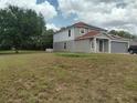 Charming home with spacious yard, solar panels, and a two-car garage at 2709 Sedgefield Ave, Deltona, FL 32725