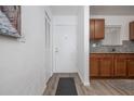 Condo entryway featuring wood-look flooring and access to kitchen and closet at 2711 N Halifax Ave # 496, Daytona Beach, FL 32118