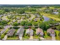 Neighborhood aerial view featuring a lovely home, nearby ponds, and convenient access to surrounding amenities at 276 Gala Cir, Daytona Beach, FL 32124