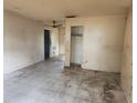 Vacant living room with tile flooring and neutral paint, awaiting renovation at 2810 Kumquat Dr, Edgewater, FL 32141