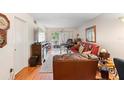 Cozy living room with wood floors and sliding door access to the patio at 313 Dirksen Dr # A5, Debary, FL 32713