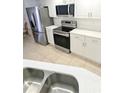 This condo has a modern kitchen equipped with stainless steel appliances and bright countertops at 3311 S Atlantic Ave # 604, Daytona Beach Shores, FL 32118