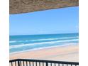 Breathtaking ocean views from the condo balcony with blue water and a sandy beach at 3311 S Atlantic Ave # 604, Daytona Beach Shores, FL 32118