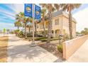 Inviting townhome complex with mature palm trees and well-maintained landscaping at 3733 Cardinal Blvd # 1, Daytona Beach, FL 32118