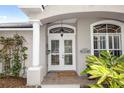 Close-up of the home's inviting front entrance, with double doors and a 'Welcome' mat at 397 Quail Hill Dr, Debary, FL 32713