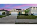 Charming single-Gathering home boasts a well-manicured lawn and a cozy, inviting facade at 5708 Sunbonnet Way, St Cloud, FL 34771