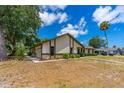 Residential home with an attached garage, showcasing its well-kept exterior and ample driveway space at 5788 Devon St, Port Orange, FL 32127