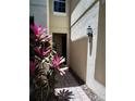 Outdoor walkway to townhouse entry with brick pavers and fresh landscaping at 6043 Strada Isle Way, Orlando, FL 32835