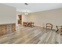 Dining room with hardwood floors, natural light, and a view into the kitchen at 672 Swarthmore Dr, Deland, FL 32724