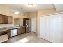 Bright kitchen featuring stainless steel appliances, tile floors, and ample cabinet space at 801 Coleman Ave, Deltona, FL 32725
