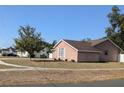 Charming brick home situated on a neatly kept corner lot with mature trees at 1250 Lemonwood Ave, Deland, FL 32724