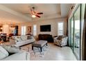 Bright living room featuring tile floors, recessed lighting, and sliding glass doors at 133 Azure Mist Way, Daytona Beach, FL 32124
