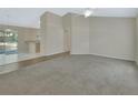Bright living space with tiled floors and a slider leading to a patio. Neutral paint at 1450 14Th St, Orange City, FL 32763