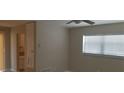 Cozy room featuring neutral paint, ceiling fan, and a bright window at 1626 S Page Dr, Deltona, FL 32725