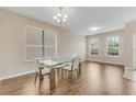 Contemporary dining room featuring a glass table with white chairs and lots of natural light at 1922 Cove Point Rd, Port Orange, FL 32128