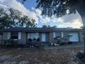 Inviting single-story home with white-framed windows and a well-maintained front yard at 2219 Howland Blvd, Deltona, FL 32738