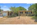 Charming single-story home featuring an attached garage and traditional design at 2327 Mulbry Dr, Winter Park, FL 32789