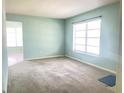 Bright living room with carpet and large window at 2332 Hadley St, Deltona, FL 32738