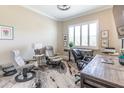 Bright and functional home office with natural light, two desks, comfortable chairs, and a neutral color palette, perfect for productivity at 2435 Pawtucket Pass, Mount Dora, FL 32757