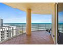 Enjoy ocean views from this spacious balcony with tiled floor and metal railing, perfect for relaxation at 2515 S Atlantic Ave # 1001, Daytona Beach Shores, FL 32118