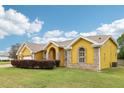Charming single-story home with a two-car garage, brick accents and manicured lawn at 2940 Se 23Rd Ave, Ocala, FL 34471