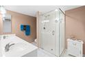 Bathroom featuring a glass-enclosed shower and double vanity at 2967 S Atlantic Ave # 1601, Daytona Beach Shores, FL 32118