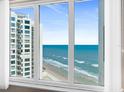 Breathtaking ocean view from a large window, showcasing the beach and waves at 2967 S Atlantic Ave # 1601, Daytona Beach Shores, FL 32118