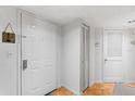 Clean and functional entryway with a classic white door, closet, and neutral decor at 3023 S Atlantic Ave # 4020, Daytona Beach, FL 32118