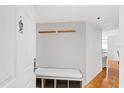 Welcoming entryway featuring a coat rack, cushioned bench with storage, and seamless access to the living area at 3023 S Atlantic Ave # 4020, Daytona Beach, FL 32118