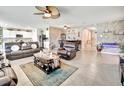 Open-concept living area with tile flooring and unique stone accent wall at 316 Nowell Loop, Deland, FL 32724