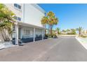 Inviting covered entrance to Mariner's Cove with seating and tropical plants at 3700 S Atlantic Ave # 413, New Smyrna Beach, FL 32169