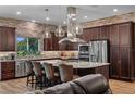 Gourmet kitchen with granite countertops, stainless steel appliances, and a central island at 5430 Nw 35Th Lane Rd, Ocala, FL 34482
