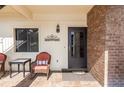 Inviting front porch with comfortable seating and decorative accents, perfect for relaxing outdoors at 576 Belltower Ave # 100, Deltona, FL 32725