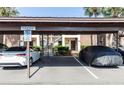Assigned covered parking, offers protection from the elements and convenient access to the property at 576 Belltower Ave # 100, Deltona, FL 32725