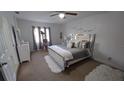 Serene bedroom featuring a decorative bed, soft lighting, and coordinated decor for a restful ambiance at 921 Valleydale Ave, Deland, FL 32720