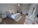 Luxurious bedroom featuring a stylish bed, a comfortable sitting area, and ample closet space at 921 Valleydale Ave, Deland, FL 32720