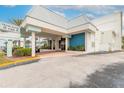 Entrance to Ocean Jewels Club condo features a covered entryway and well-maintained landscaping at 935 S Atlantic Ave # 363, Daytona Beach, FL 32118