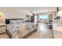 Interior view of condo featuring bed, kitchenette, dining area and a view of the ocean at 935 S Atlantic Ave # 363, Daytona Beach, FL 32118