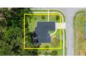 Aerial image outlining property boundaries featuring manicured lawns, mature trees, and residential neighborhood at 941 Pizarro Dr, Daytona Beach, FL 32119