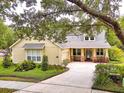 Lovely home with a well-kept lawn, inviting porch, and ample parking on the concrete driveway at 1018 Heron Point Cir, Deland, FL 32724