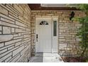 Close-up of the front door featuring a modern design and house number at 1209 James Ter, Daytona Beach, FL 32117