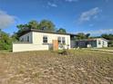 Well-maintained single-story house with a well manicured lawn at 1408 W Wellington Dr, Deltona, FL 32725