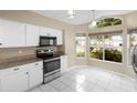 Bright kitchen features modern appliances and a cozy breakfast nook at 14634 Brightwell Ct, Orlando, FL 32824