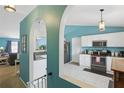 Bright kitchen featuring granite counters, white cabinets, and stainless steel appliances at 149 Angeles Rd, Debary, FL 32713